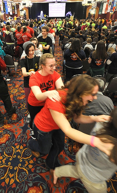 Catholic Youth form a human chain in the Grand Ballroom of the Adams Mark Hotel during the 